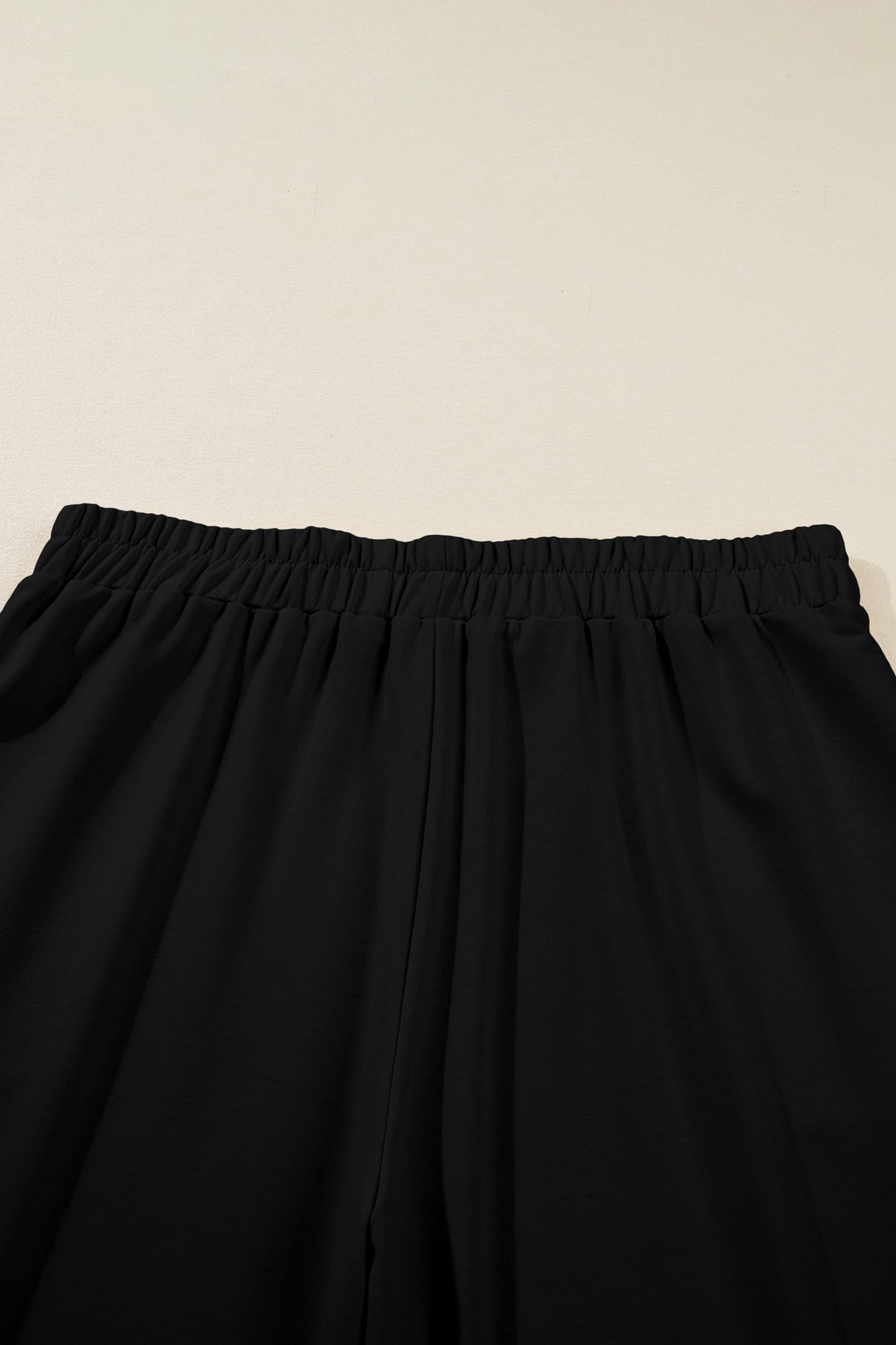 Black Plus Size Elastic Waist Asymmetrical Hem Loose Capris Pants